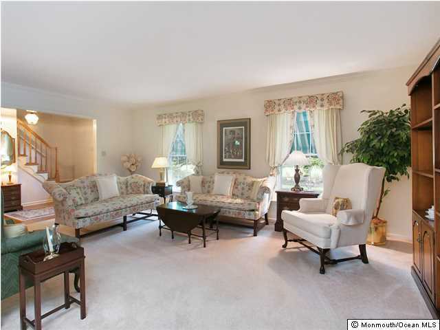 32 Woodhollow Road Colts Neck, NJ 07722 - Photo 3 of 23 a living room with furniture and a large window