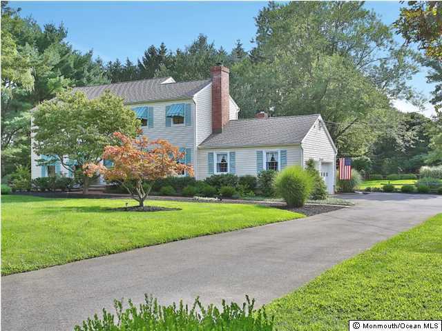 32 Woodhollow Road Colts Neck, NJ 07722 - Photo 23 of 23 a front view of a house with garden