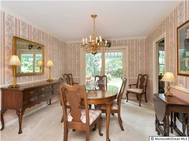 32 Woodhollow Road Colts Neck, NJ 07722 - Photo 4 of 23 a dining room with furniture a chandelier and window