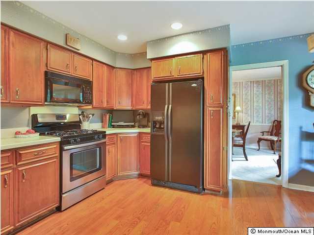 32 Woodhollow Road Colts Neck, NJ 07722 - Photo 5 of 23 a kitchen with stainless steel appliances granite countertop a refrigerator stove and sink