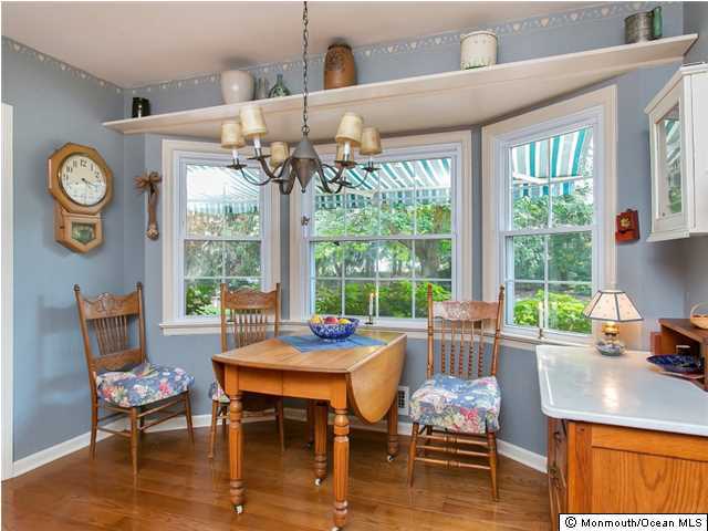 32 Woodhollow Road Colts Neck, NJ 07722 - Photo 6 of 23 a dining room with furniture a rug and a floor to ceiling window