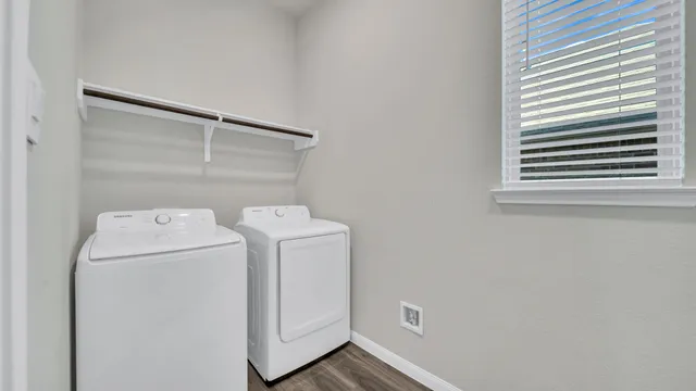 a utility room with dryer and washer