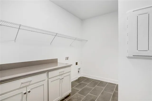 a kitchen with a sink window and cabinets