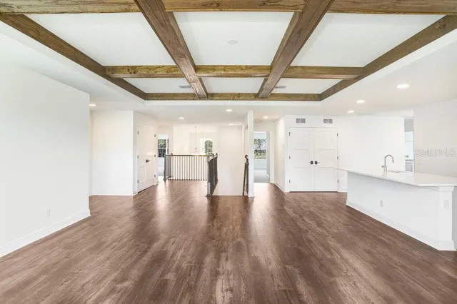 a view of a big room with windows and closet