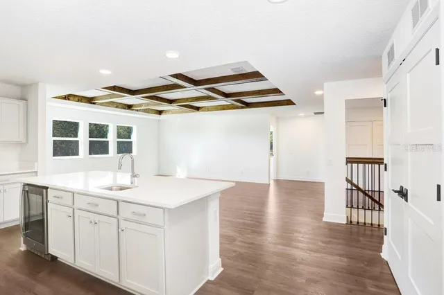 a bathroom with a sink a toilet and a window
