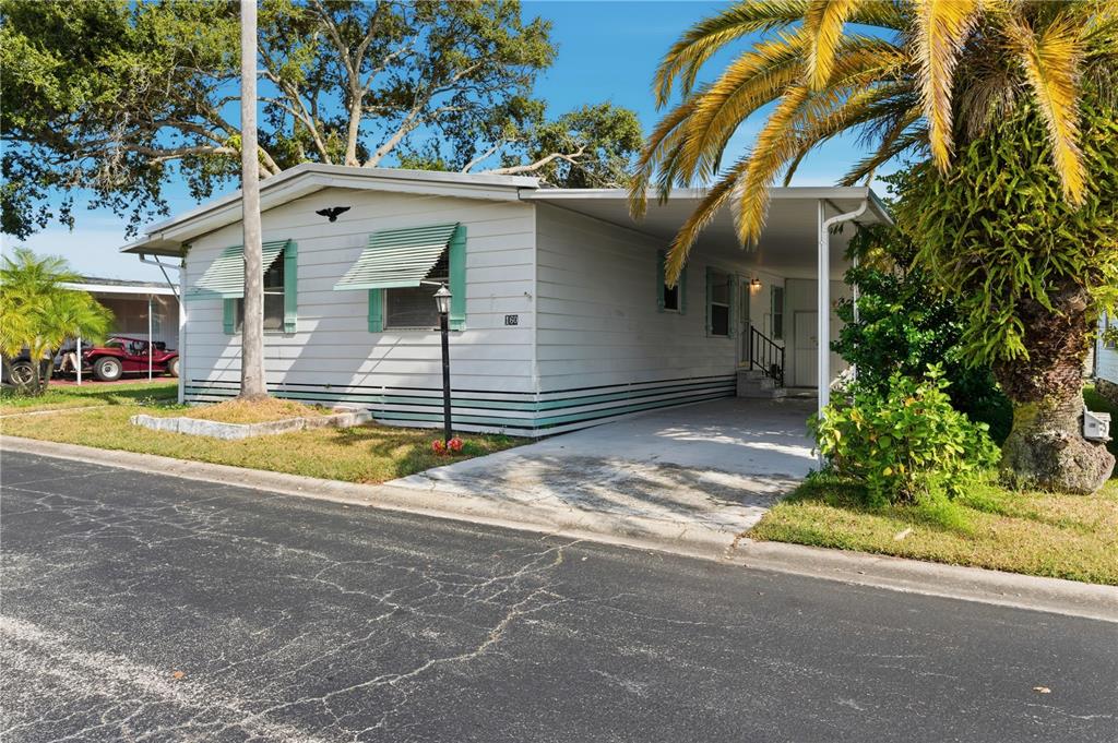 1000 Walker Street, Unit 160 Daytona Beach, FL 32117 - Photo 1 of 34 a view of a house with backyard and sitting area