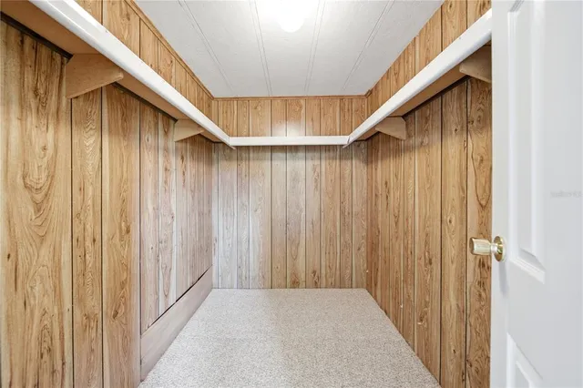 a bathroom with a granite countertop sink mirror vanity and toilet