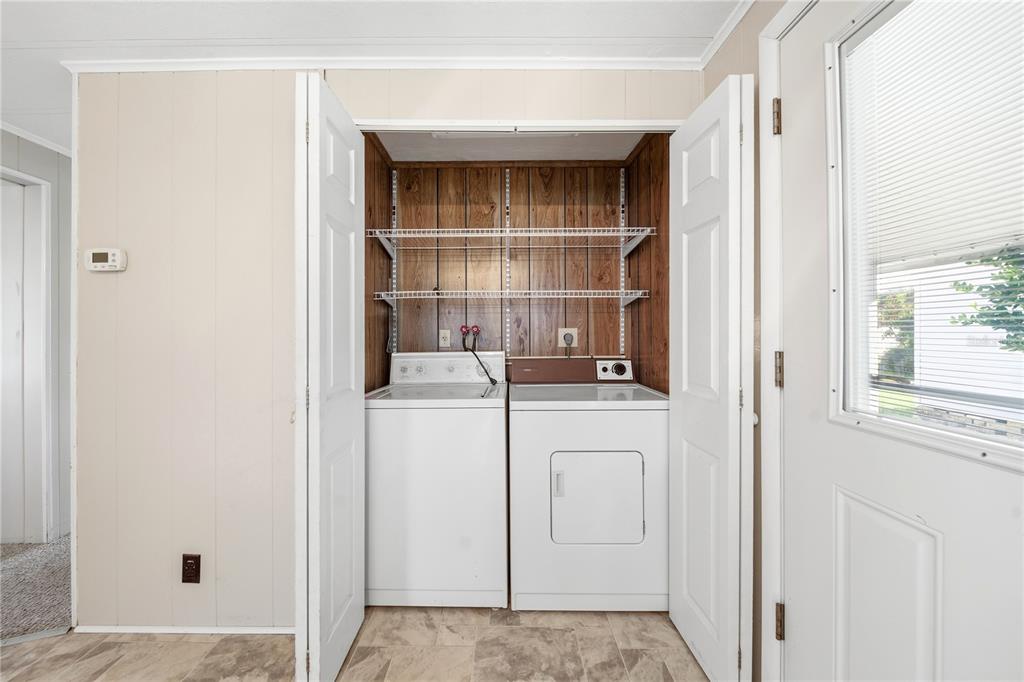 1000 Walker Street, Unit 160 Daytona Beach, FL 32117 - Photo 20 of 34 a room with closet and dryer