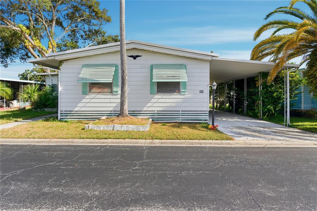 1000 Walker Street, Unit 160 Daytona Beach, FL 32117 - Photo 21 of 34 a view of pool house front of house