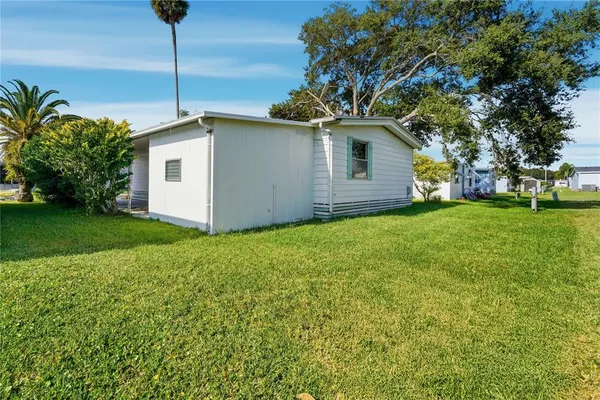 a view of a street with a cars parked on the road
