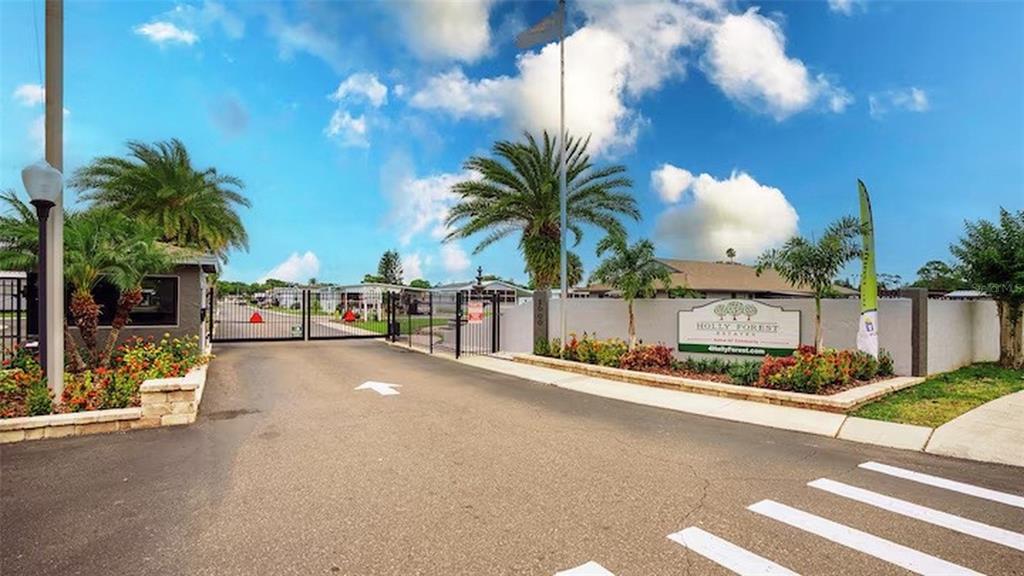 1000 Walker Street, Unit 160 Daytona Beach, FL 32117 - Photo 24 of 34 a view of a street with a cars parked on the road