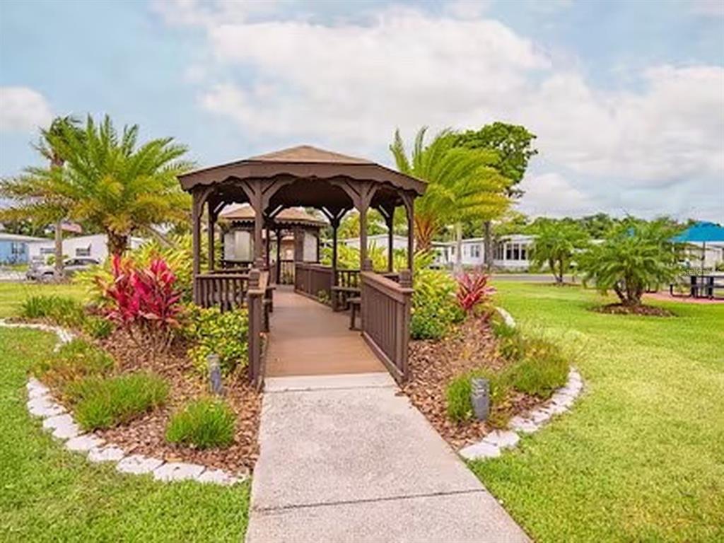 1000 Walker Street, Unit 160 Daytona Beach, FL 32117 - Photo 26 of 34 a view of a garden with patio
