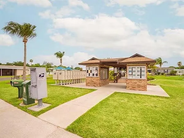 a view of a swimming pool with a lounge chairs