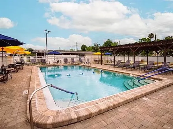 a patio with a table a table and chairs