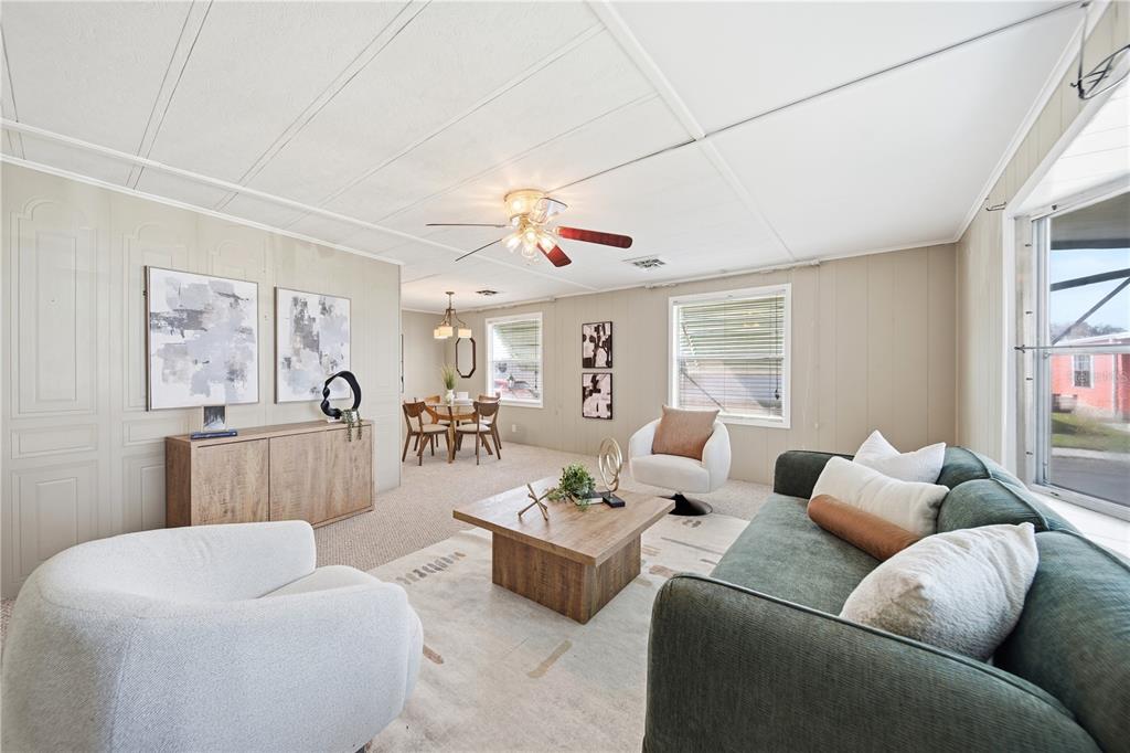 1000 Walker Street, Unit 160 Daytona Beach, FL 32117 - Photo 4 of 34 a living room with furniture and a large window