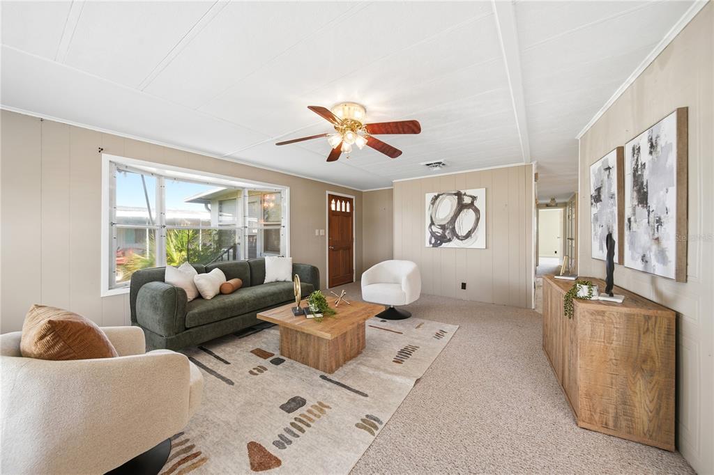 1000 Walker Street, Unit 160 Daytona Beach, FL 32117 - Photo 7 of 34 a living room with furniture and a large window