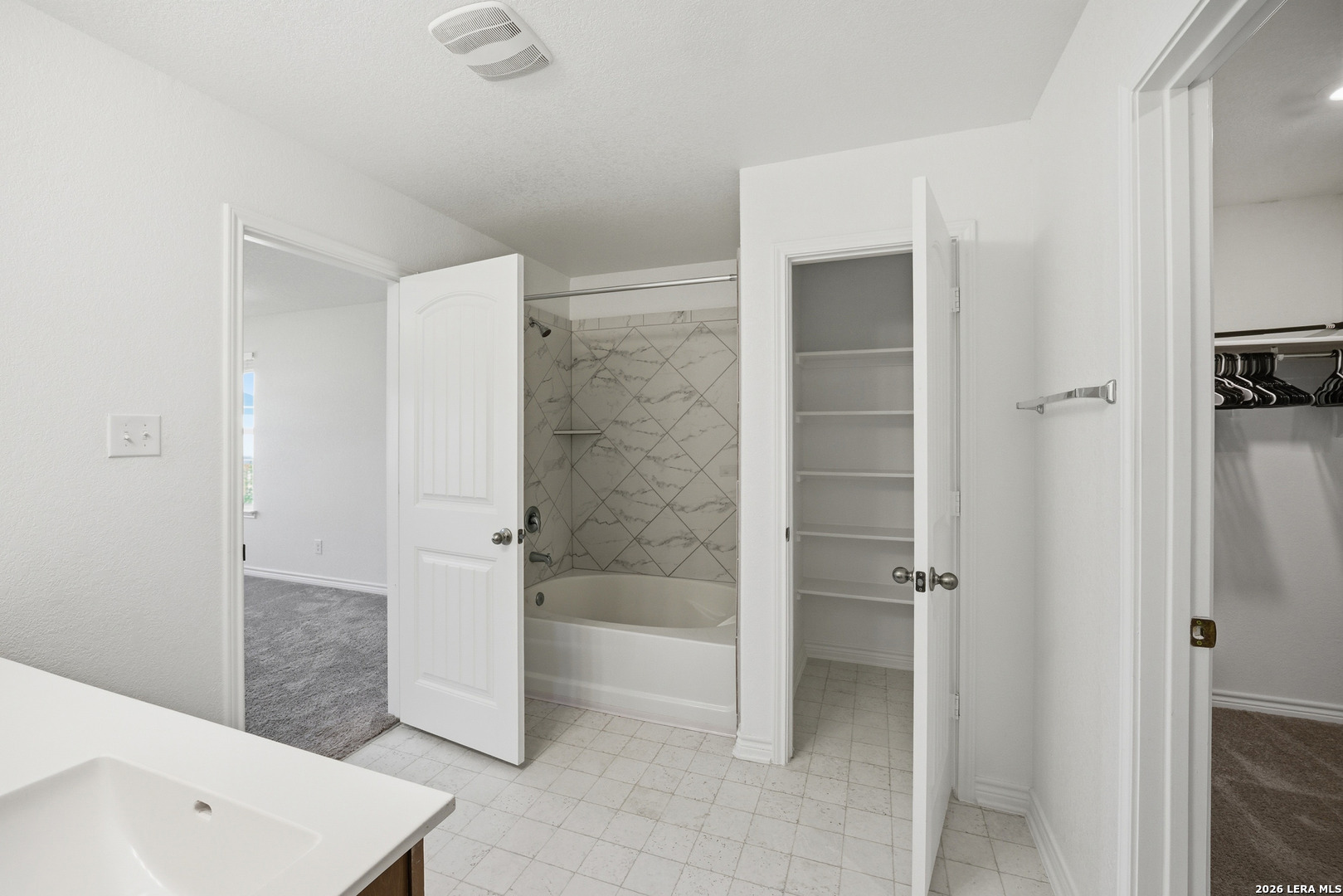 11331 Edelweiss San Antonio, TX 78245 - Photo 11 of 19 a bathroom with a bathtub and a shower
