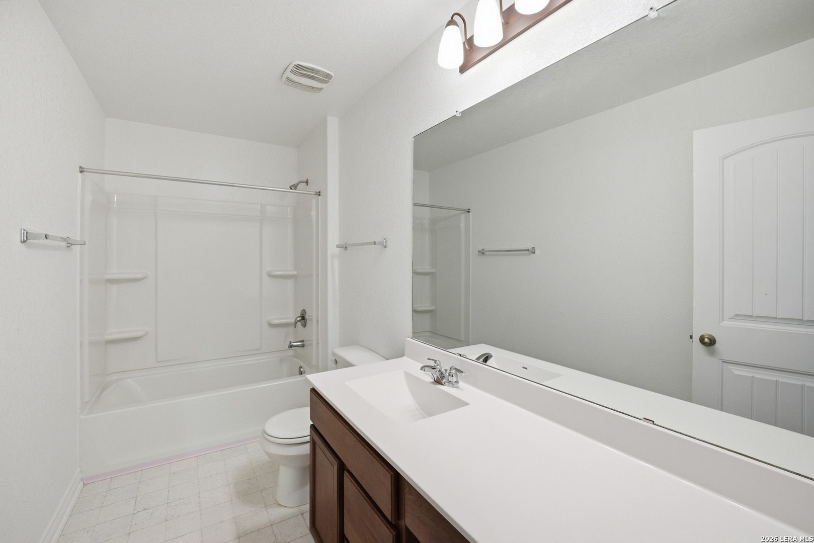 11331 Edelweiss San Antonio, TX 78245 - Photo 12 of 19 a bathroom with a sink a toilet and shower