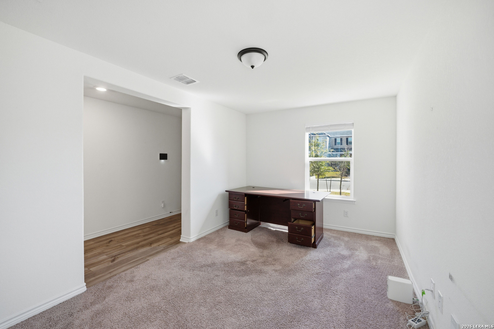 11331 Edelweiss San Antonio, TX 78245 - Photo 2 of 19 a view of workspace with furniture and window