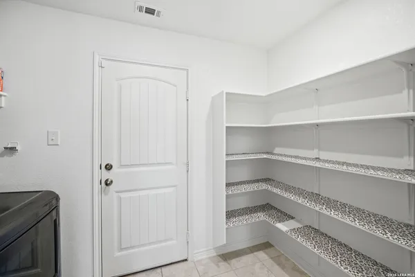 a storage room with washer and dryer