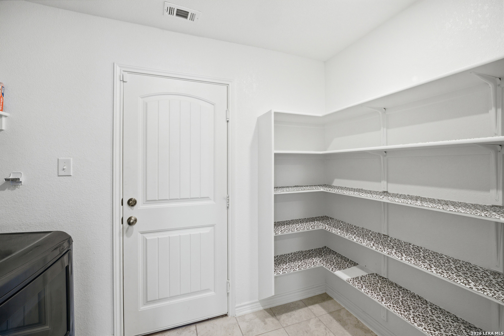 11331 Edelweiss San Antonio, TX 78245 - Photo 7 of 19 a storage room with washer and dryer