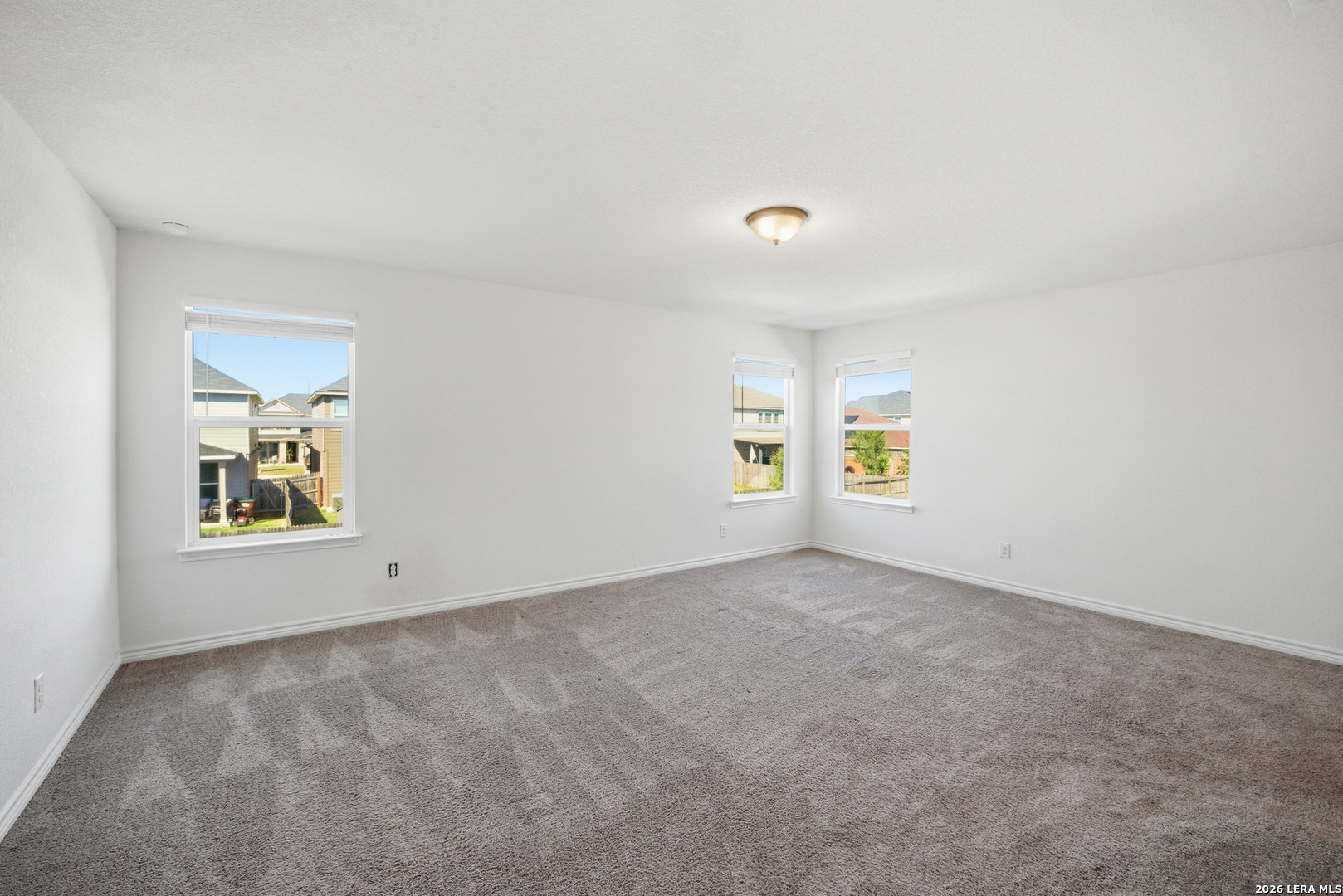 11331 Edelweiss San Antonio, TX 78245 - Photo 10 of 19 an empty room with windows and wall
