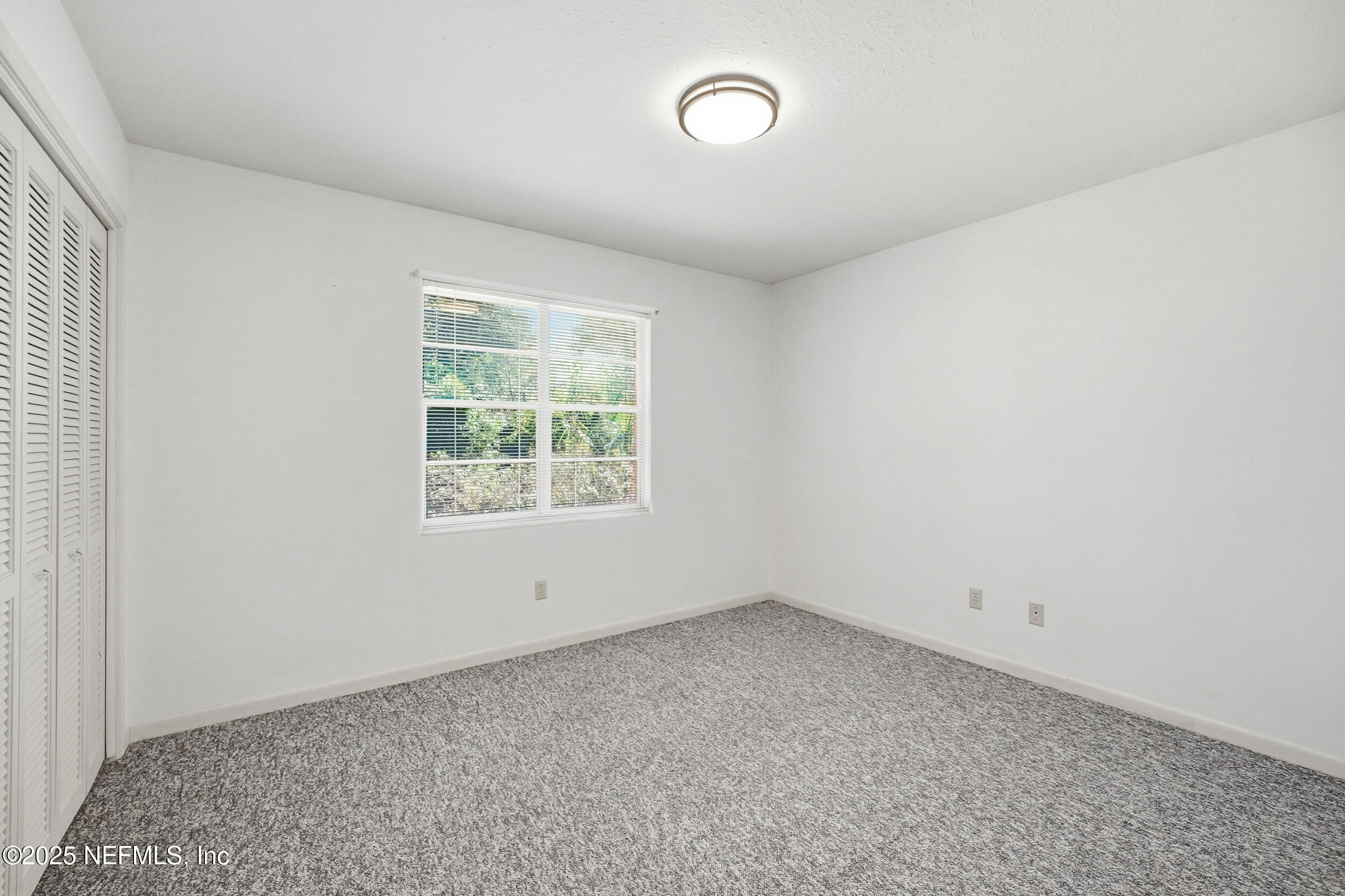 4073 Big Hollow Lane Jacksonville, FL 32277 - Photo 19 of 31 an empty room with a window
