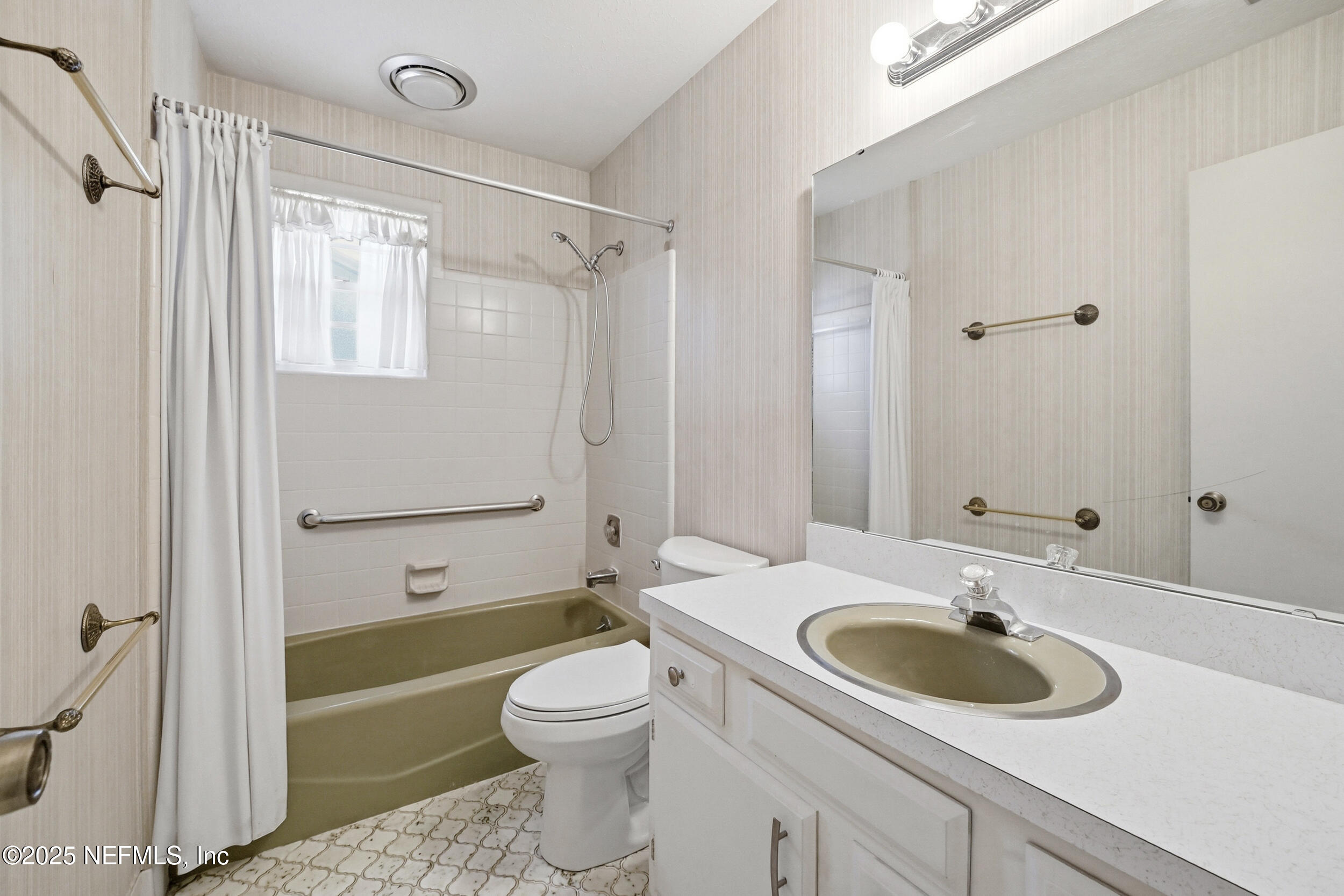 4073 Big Hollow Lane Jacksonville, FL 32277 - Photo 20 of 31 a bathroom with a sink toilet and shower