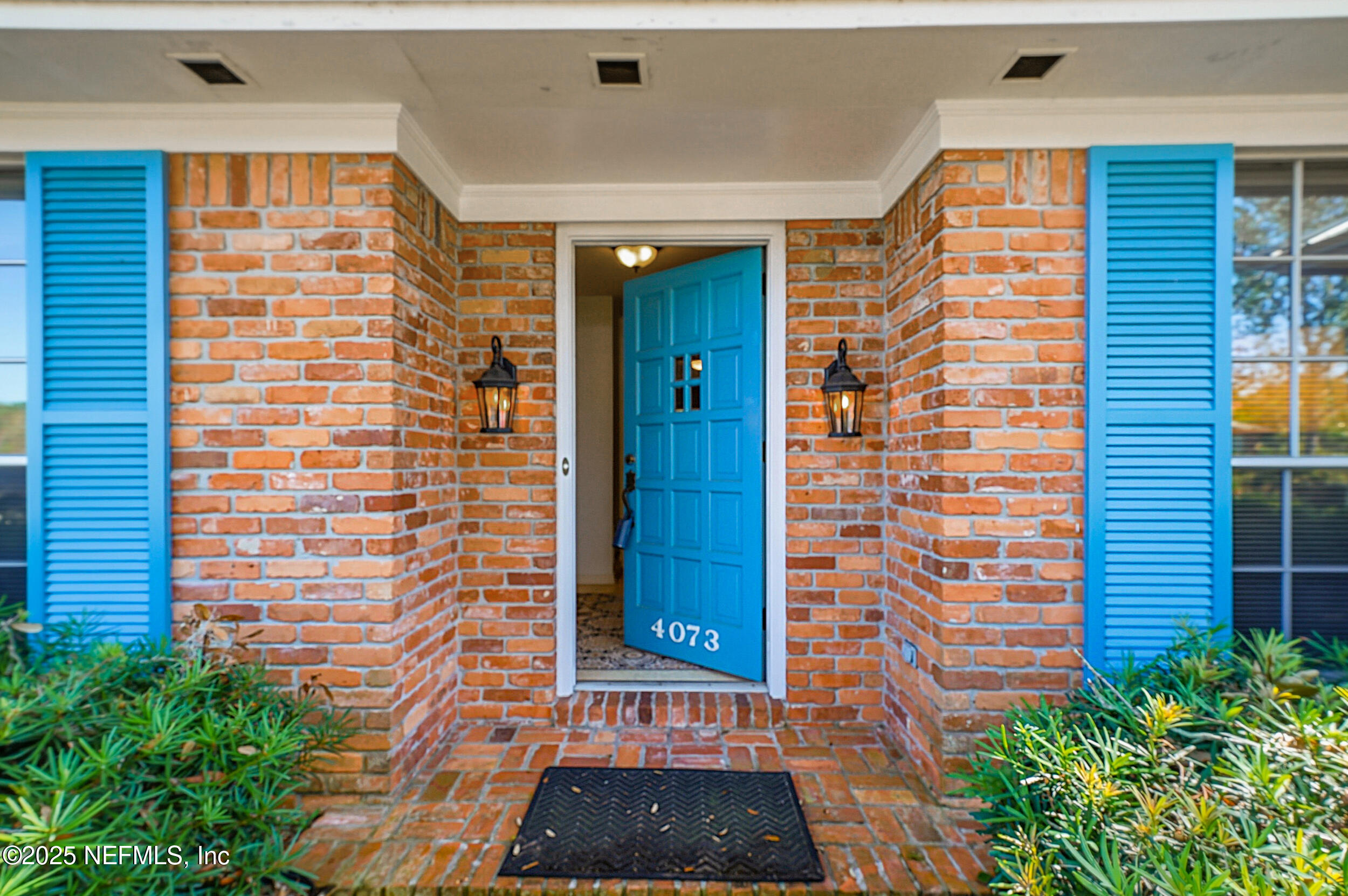 4073 Big Hollow Lane Jacksonville, FL 32277 - Photo 2 of 31 a front view of a house with a yard
