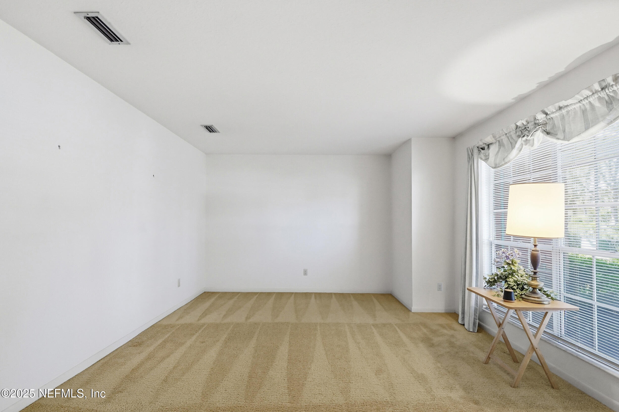 4073 Big Hollow Lane Jacksonville, FL 32277 - Photo 4 of 31 an empty room with windows