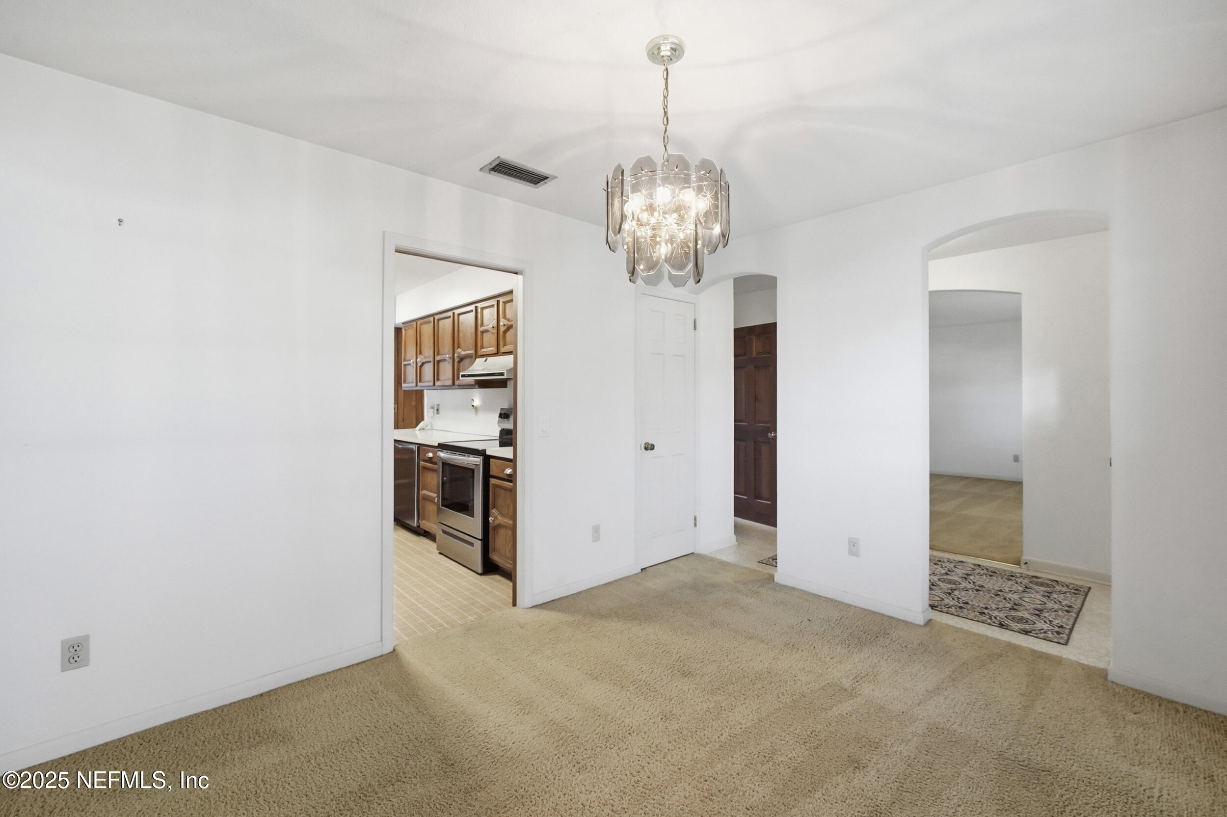 4073 Big Hollow Lane Jacksonville, FL 32277 - Photo 6 of 31 a view of a kitchen with a sink and refrigerator