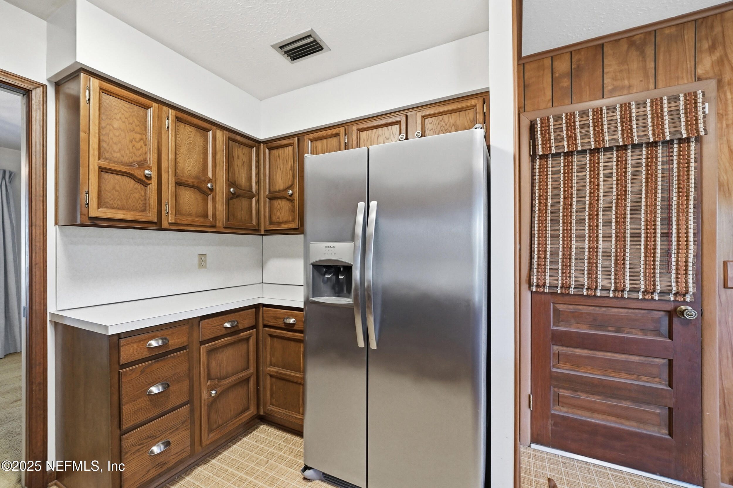 4073 Big Hollow Lane Jacksonville, FL 32277 - Photo 9 of 31 a kitchen with stainless steel appliances granite countertop a refrigerator and cabinets