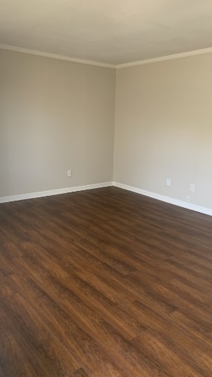 7315 Brompton Street, Unit 366B Houston, TX 77025 - Photo 5 of 11 a view of an empty room with wooden floor and a window