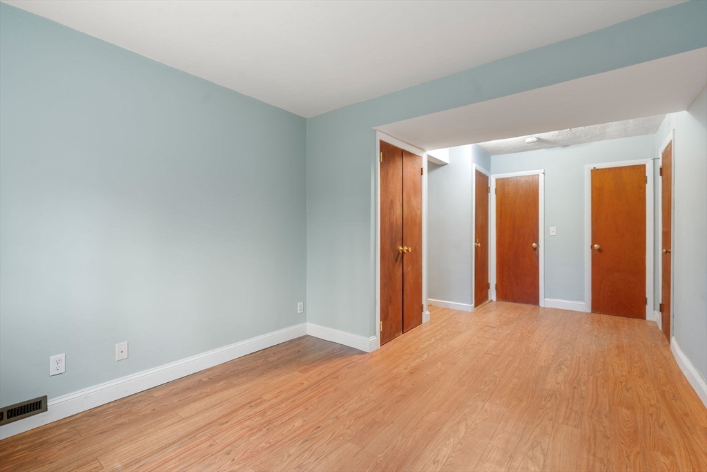 18 Royce Road Framingham, MA 01701 - Photo 19 of 30 a view of a room with wooden floor and closet