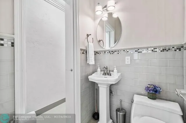 a bathroom with a sink and mirror