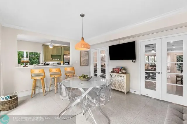 a view of a livingroom with furniture and flat screen tv