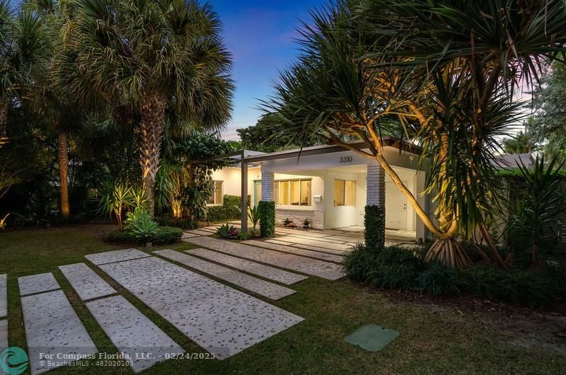 3310 Northeast 18th Street Fort Lauderdale, FL 33305 - Photo 27 of 39 a front view of a house with garden
