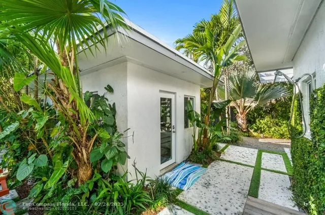 a view of a house with small garden