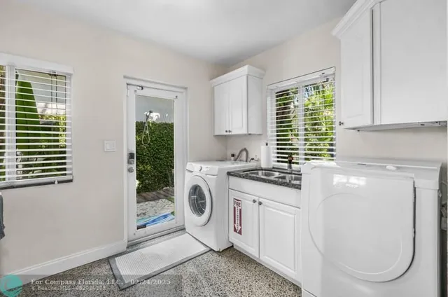 a kitchen with cabinets and window