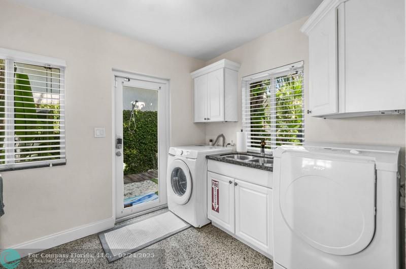 3310 Northeast 18th Street Fort Lauderdale, FL 33305 - Photo 35 of 39 a kitchen with cabinets and window