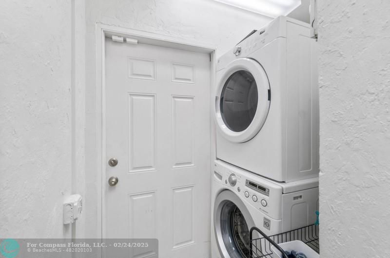 3310 Northeast 18th Street Fort Lauderdale, FL 33305 - Photo 36 of 39 a view of a storage and utility room with washer and dryer