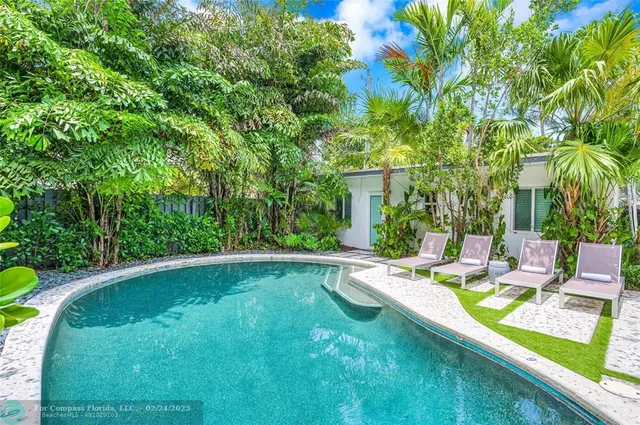 a view of a swimming pool with a patio