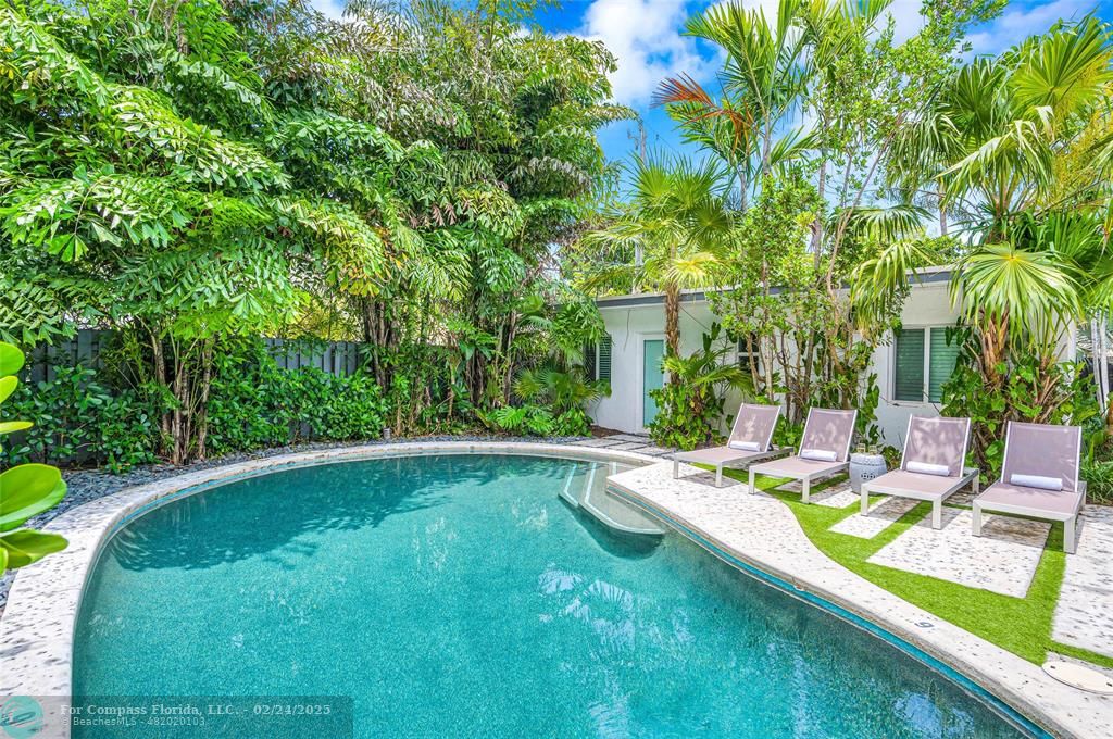 3310 Northeast 18th Street Fort Lauderdale, FL 33305 - Photo 5 of 39 a view of a swimming pool with a patio