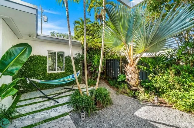 a view of a chair and table in the patio