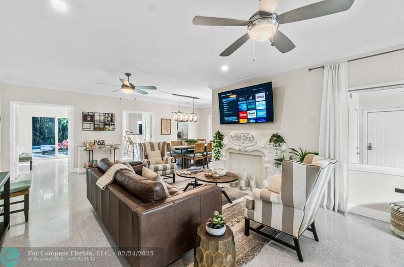 3310 Northeast 18th Street Fort Lauderdale, FL 33305 - Photo 8 of 39 a living room with furniture and a flat screen tv
