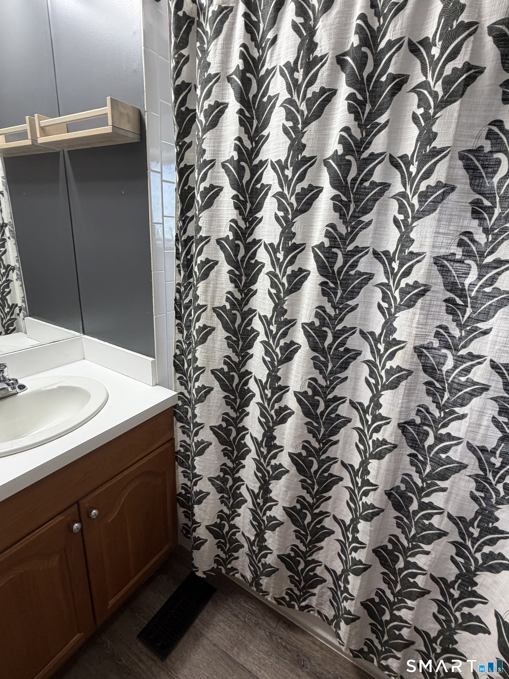 70 Meadow Street Ansonia, CT 06401 - Photo 11 of 12 a bathroom with a sink and mirror