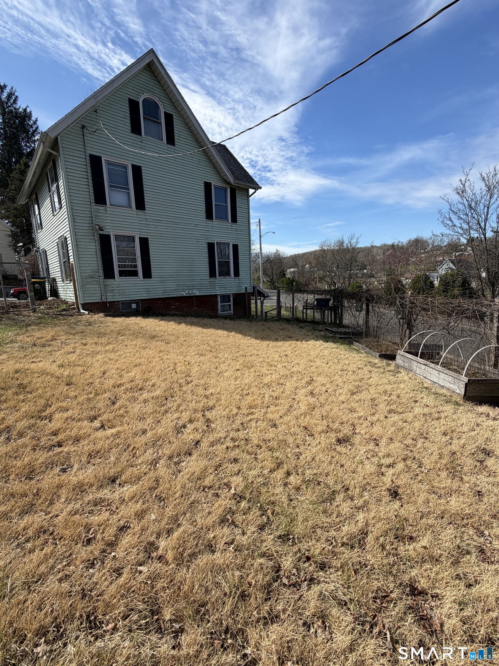 70 Meadow Street Ansonia, CT 06401 - Photo 12 of 12 a view of house with yard