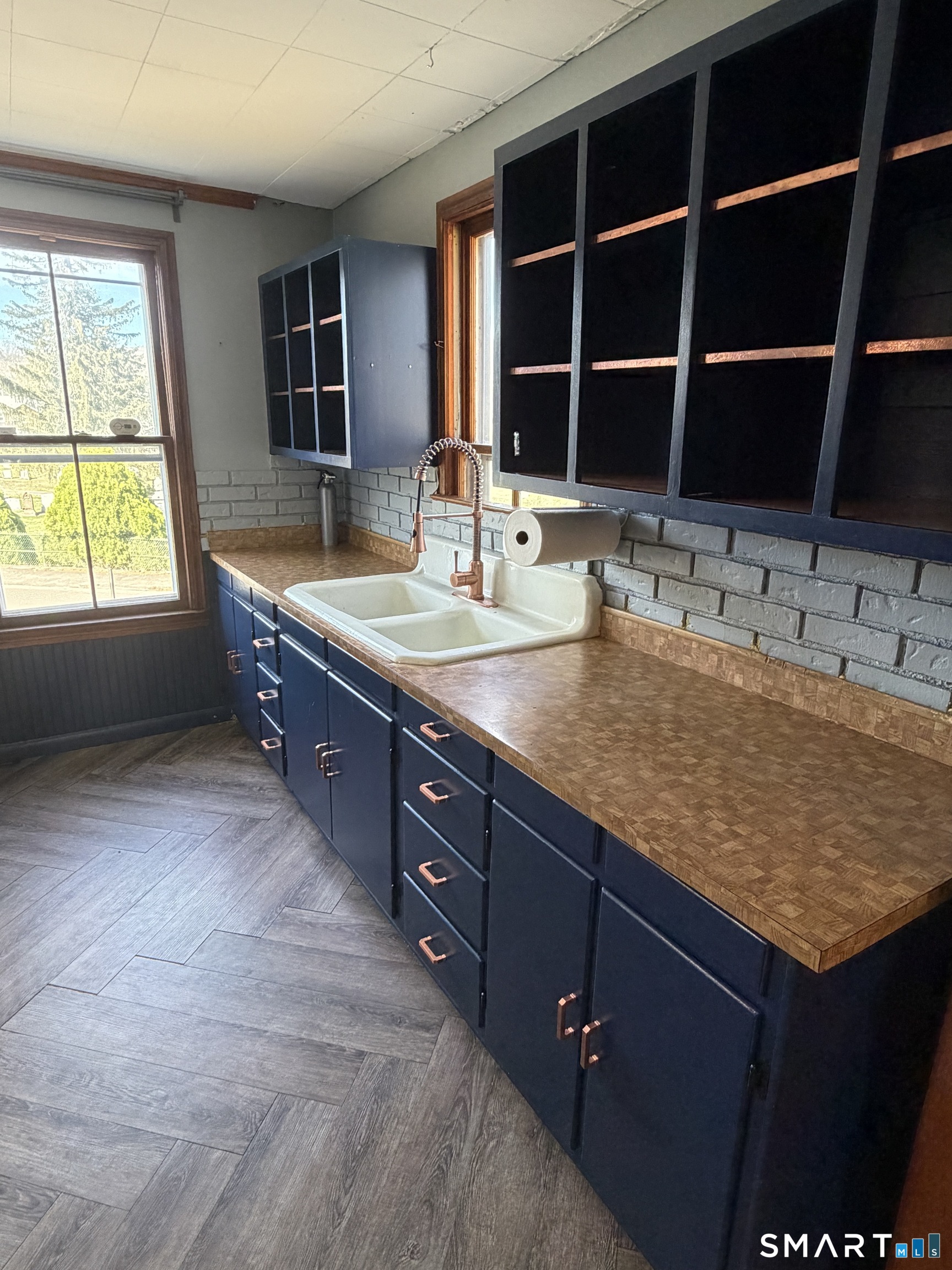 70 Meadow Street Ansonia, CT 06401 - Photo 4 of 12 a bathroom with a granite countertop sink and a large mirror