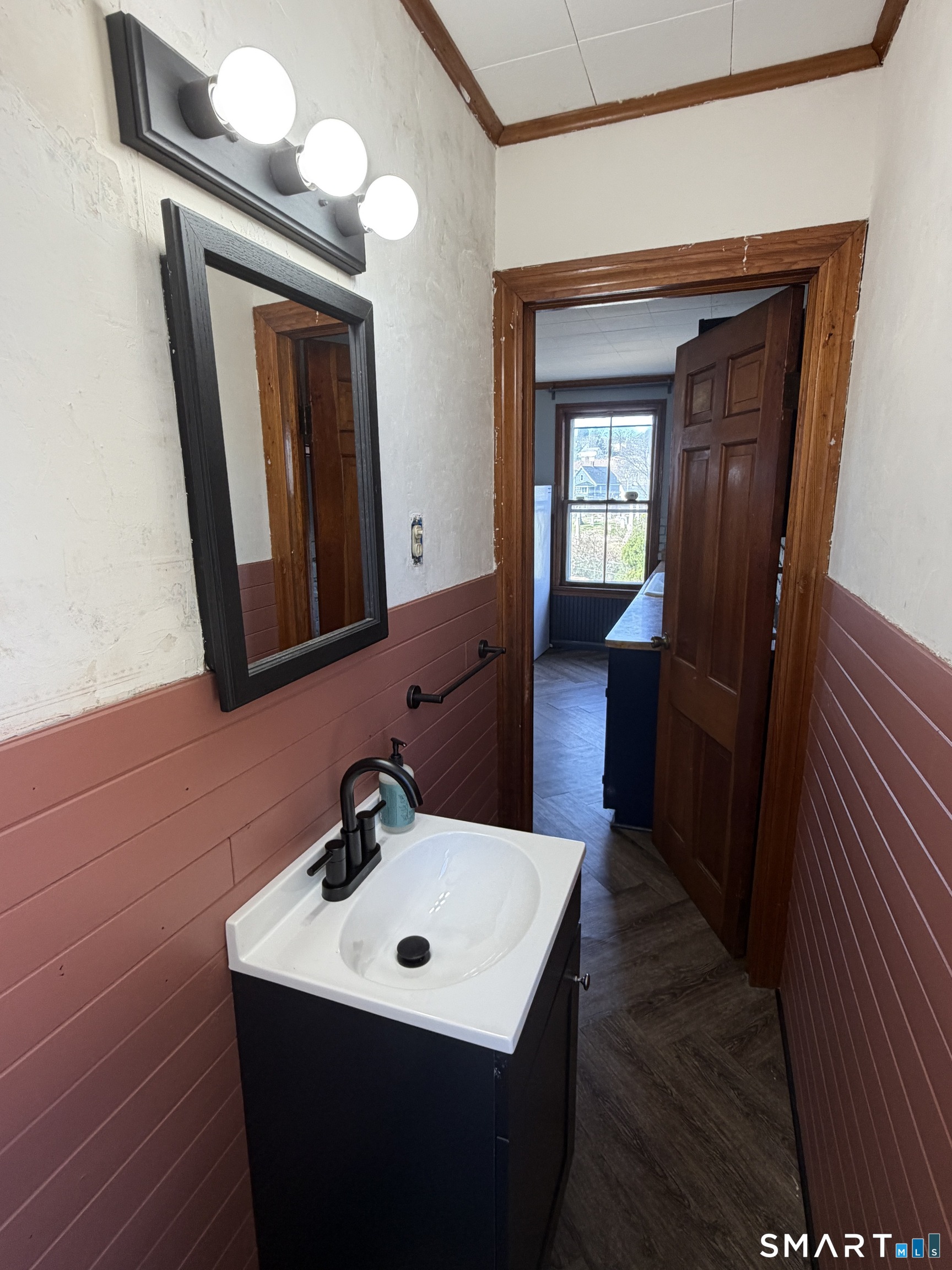 70 Meadow Street Ansonia, CT 06401 - Photo 6 of 12 a bathroom with a sink and a mirror
