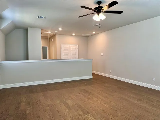a bathroom with a double vanity sink toilet and a mirror